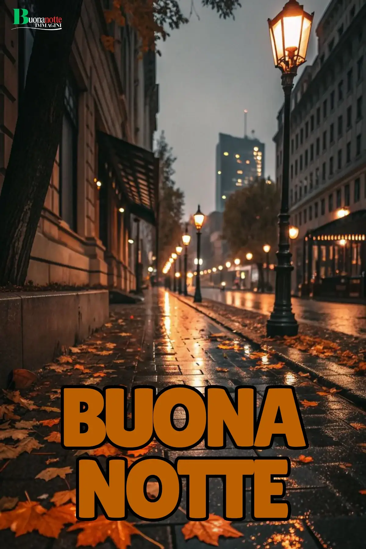 Viale cittadino notturno con lampioni foglie autunnali e pioggia buonanotte autunnale