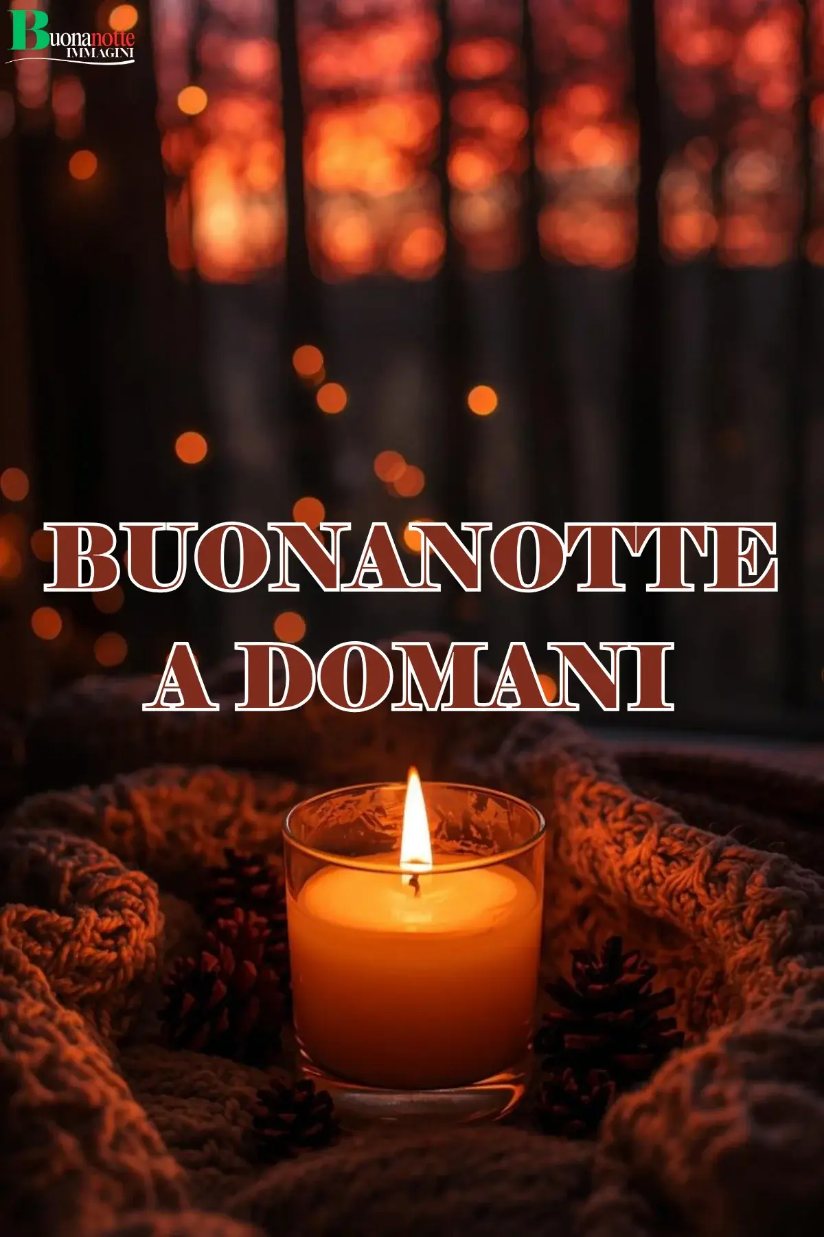 Candela accesa su coperta a maglia con pigne buonanotte a domani