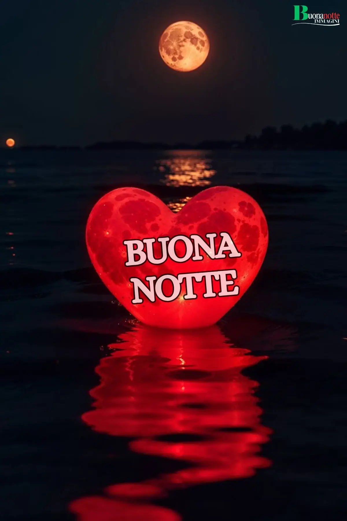 Cuore rosso luminoso sull'acqua buonanotte sogni d'oro