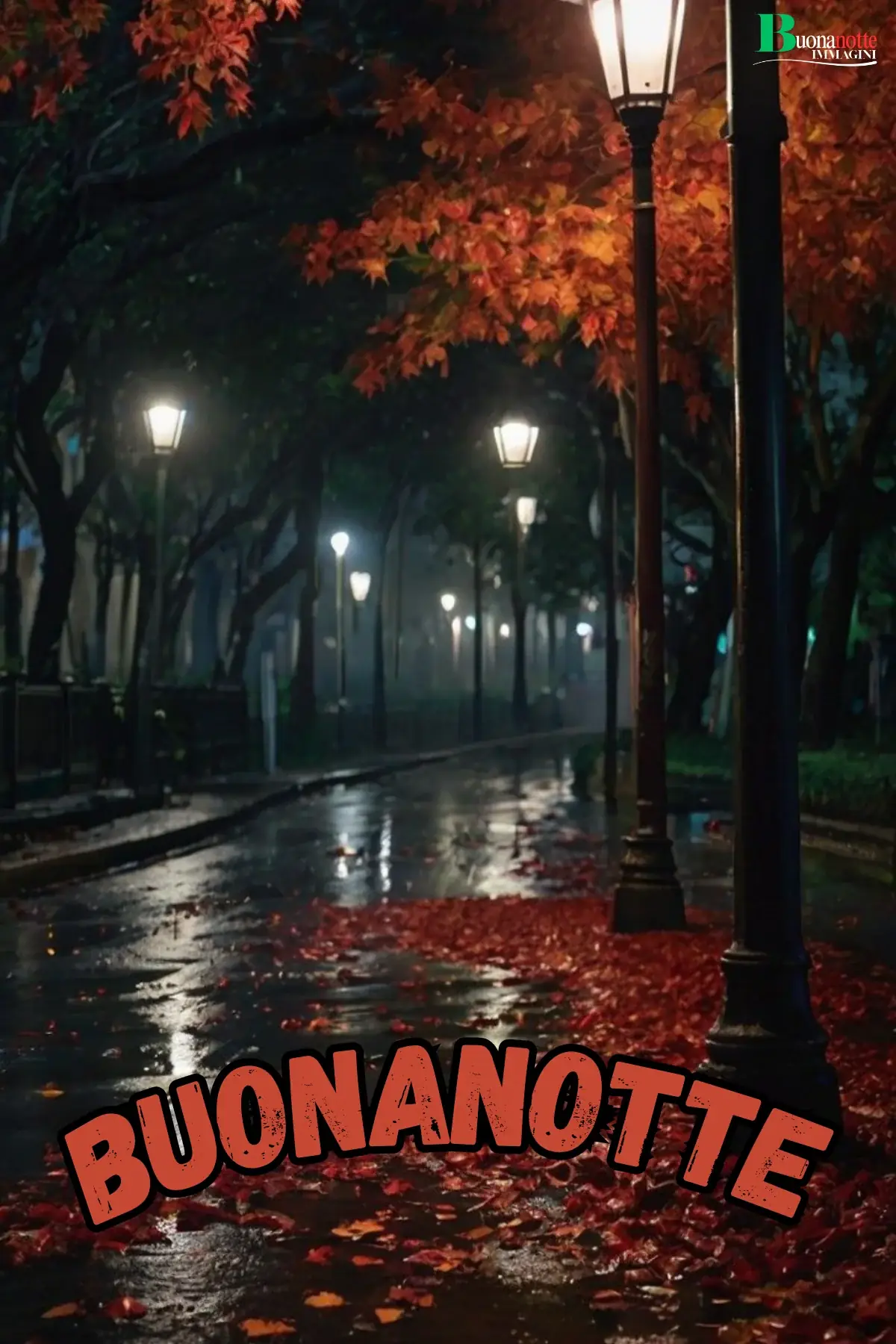 Viale notturno piovoso con lampioni e foglie rosse buonanotte autunnale
